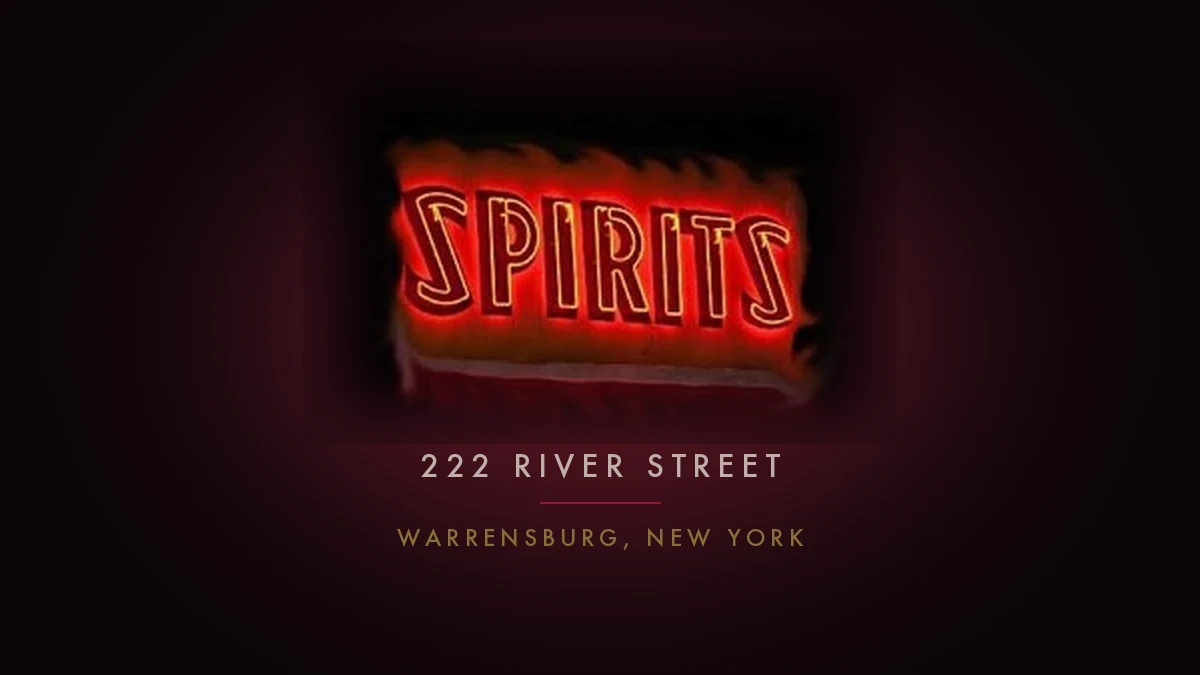 The red neon SPIRITS sign lit against the dark of the barroom